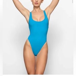 SKIMS Scoopneck 1 piece swimsuit in aqua.